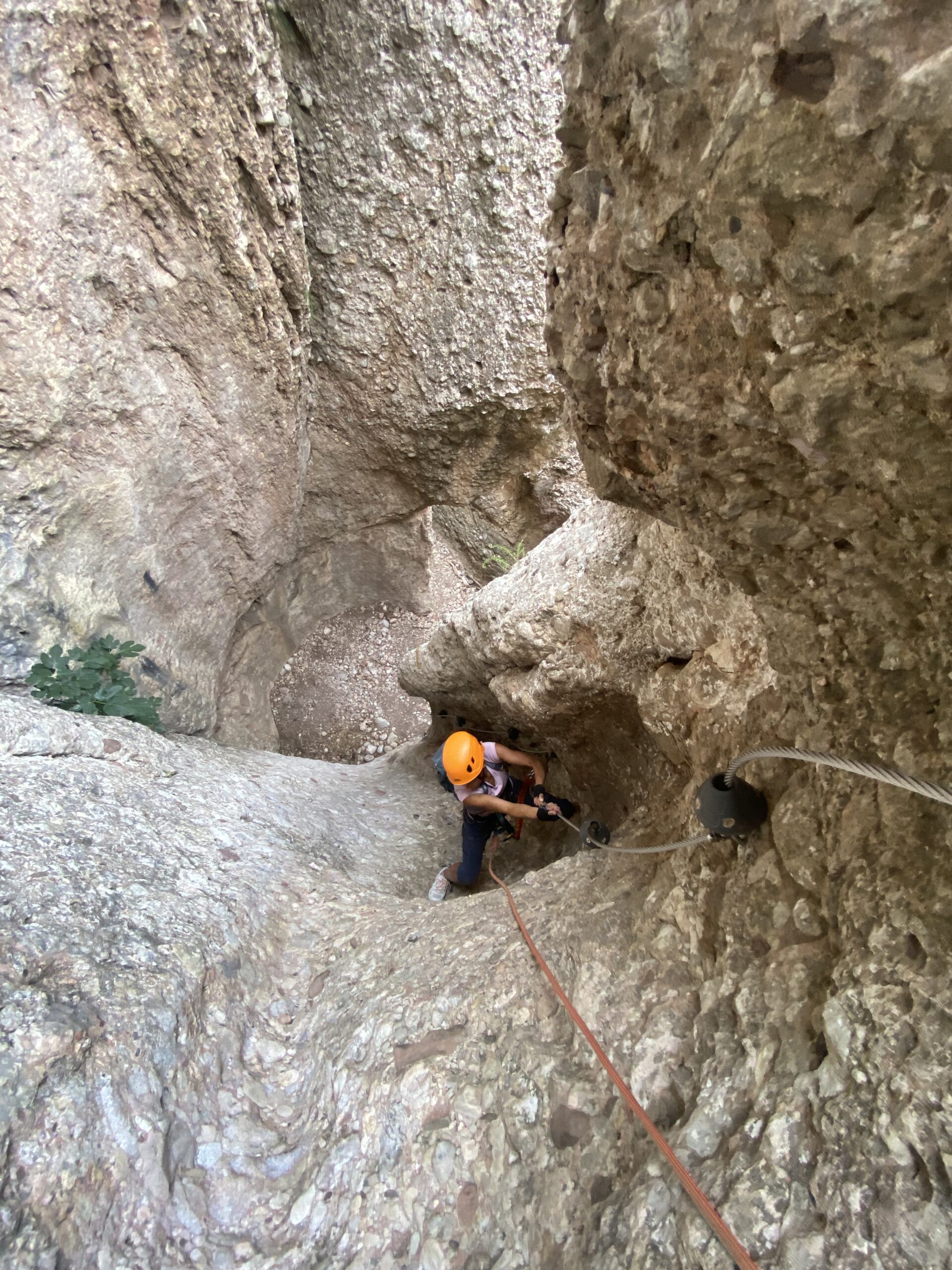 Climbing the Canal de las Damas via ferrata on the south face of Montserrat